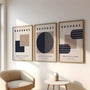 navy and beige bauhaus poster set arranged as modern gallery wall