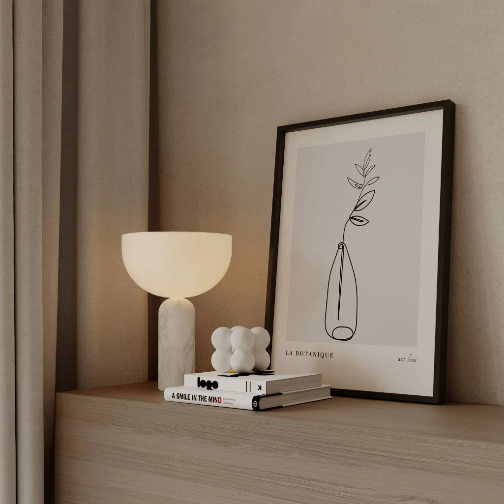 Botanical line art poster displayed in gallery wall with minimalist wall art