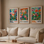 Pink orange turquoise floral poster set of 3 in living room, modern botanical wall decor above sofa